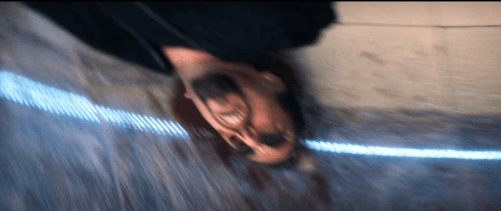 A closer but blurrier image of Ratner's corpse continued from the previous screencap. This one is zoomed in slightly from the previous image.